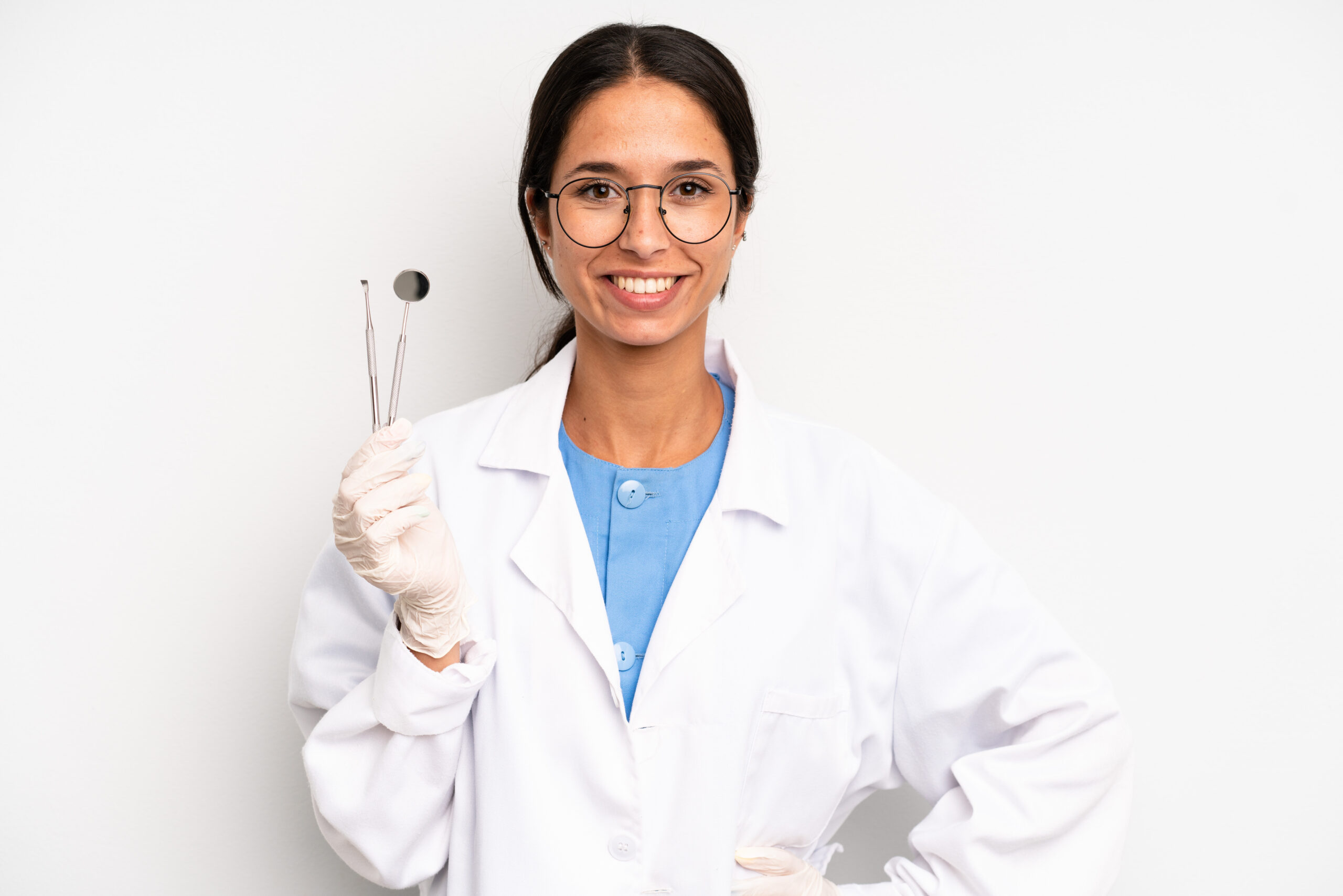 dentist holding dental tools